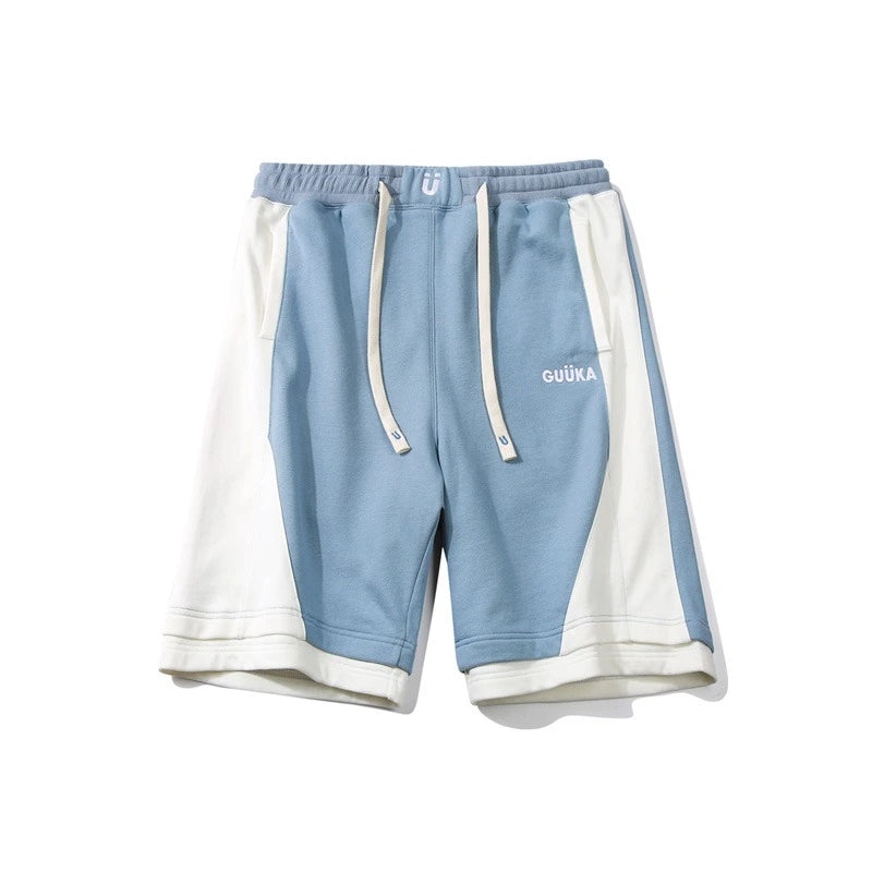 Light blue stitched shorts styled for a casual summer look.