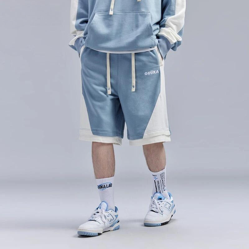 Light blue stitched fake two-piece shorts for teen boys.