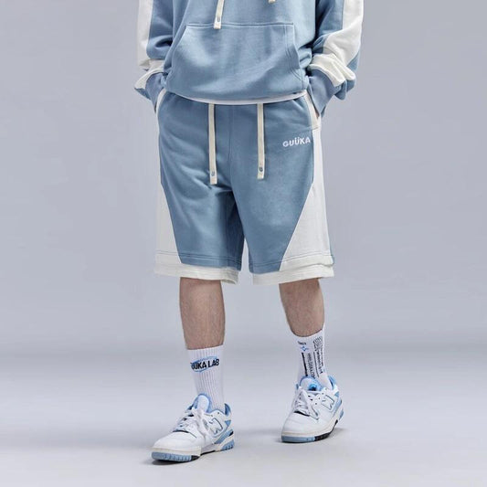 Light blue stitched fake two-piece shorts for teen boys.