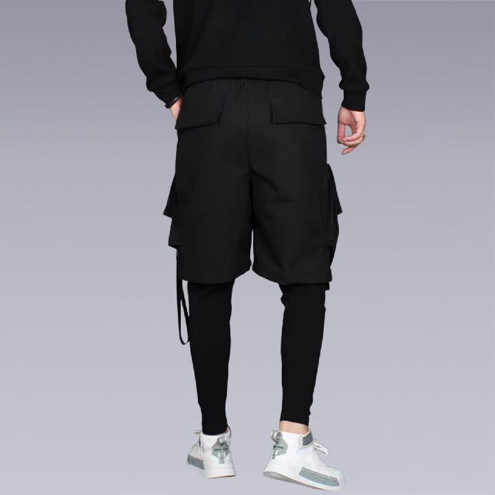 Clotechnow The trouser is designed with an elastic waist and 3/4 length leg and features slanted pockets. Lightweight cotton poplin with functional buttons and functional pockets. FUNCTIONAL STREETWEAR HAREM PANTS. Back pose