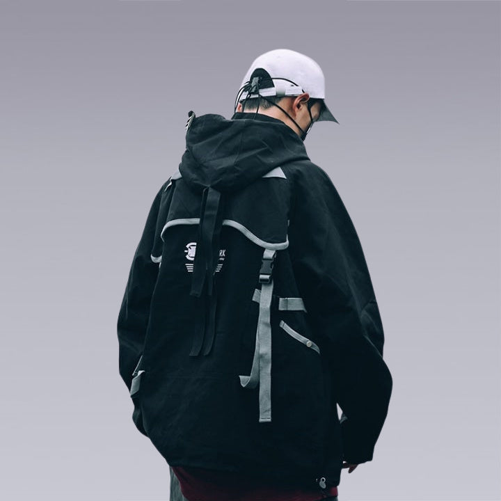 Men wearing the original dark blue techwear jacket with straps and white cap, back image