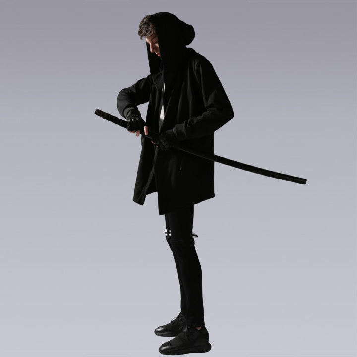 Men standing wearing the black hooded coat and holding the samurai sword