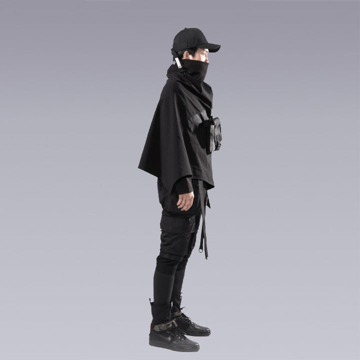 A man wearing the cyberpunk / techwear zip up black cape - Right Side