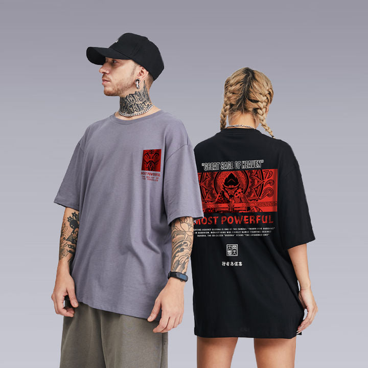A tattooed Man wearing the UNISEX Kimura Sensei T-SHIRT in grey color, and a girl standing next to him wearing the same t-shirt in black color