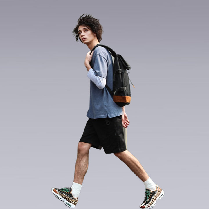 man wearing the Japanese backpack in black and khaki color