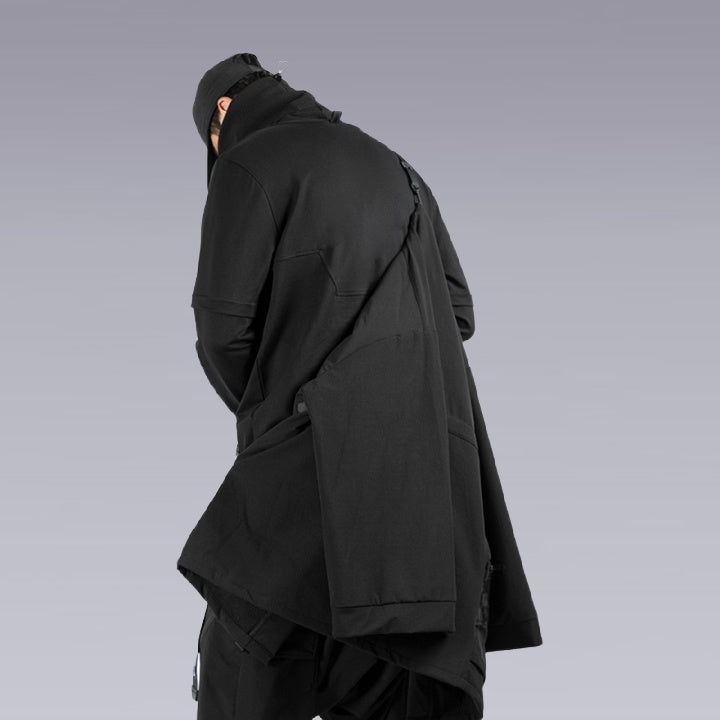 A man wearing the Techwear Ninja Black Kimono and showing its functionality
