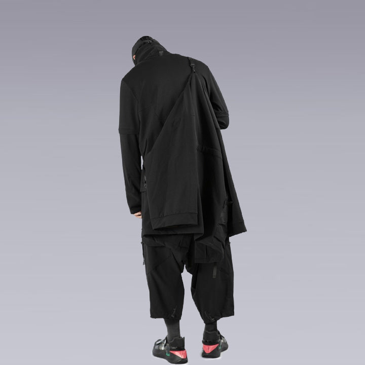 A man wearing the techwear ninja black kimono and techwear pants