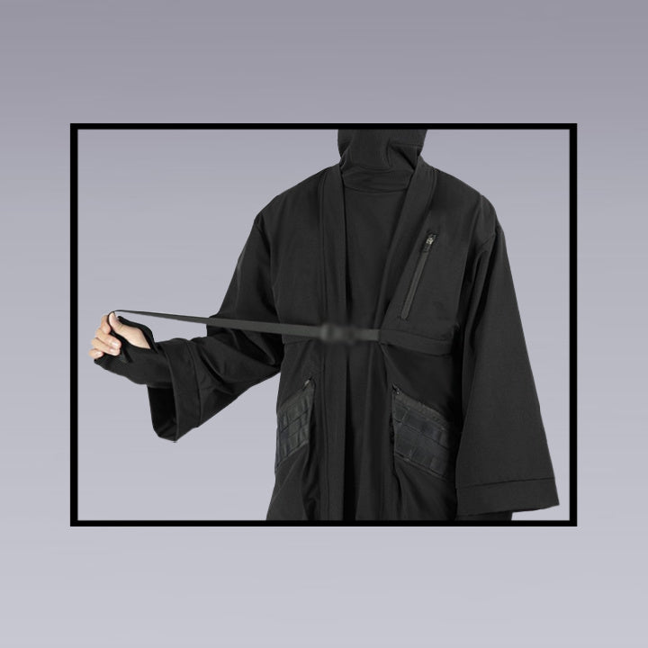 A man fastens the chest belt of the techwear ninja black kimono, detailed image