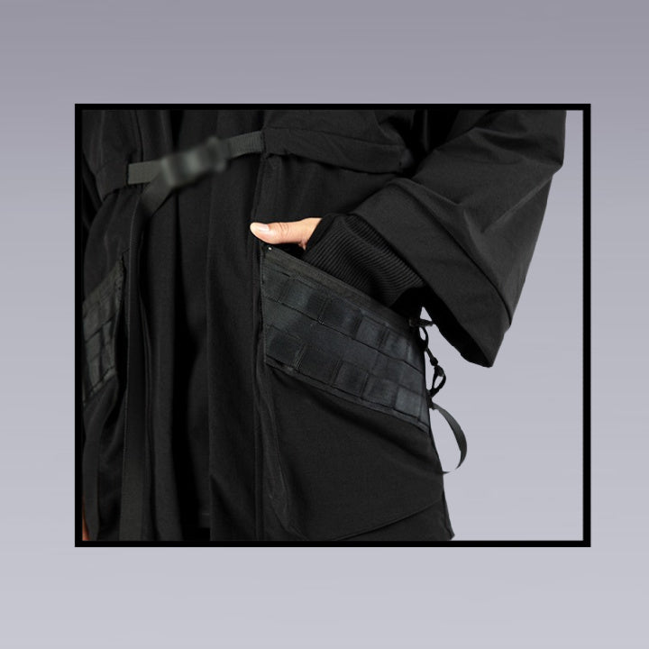 Image close up of the techwear black kimono pocket from the front side.