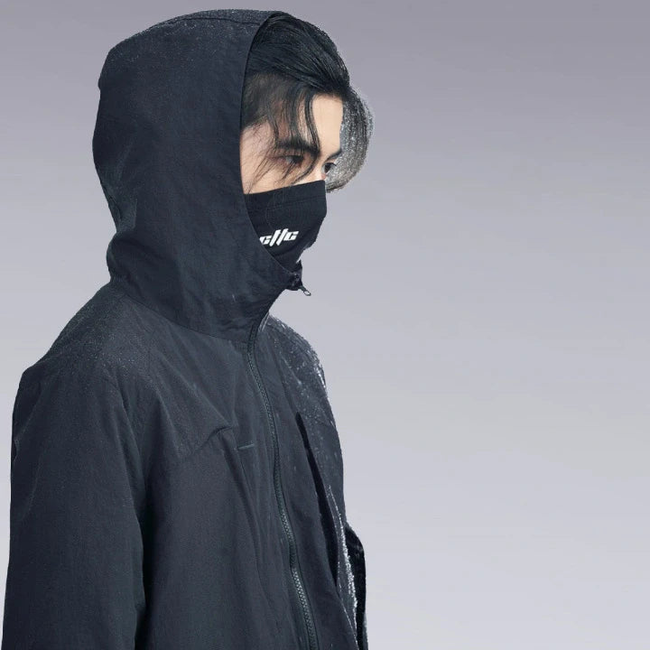 A man wearing the Hardshell Techwear Jacket and face mask. Image Close-up